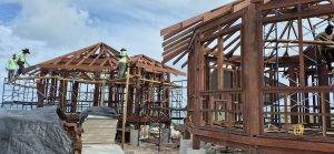 Timber structure in progress using sustainable Merbau wood, built on sandy shoreline