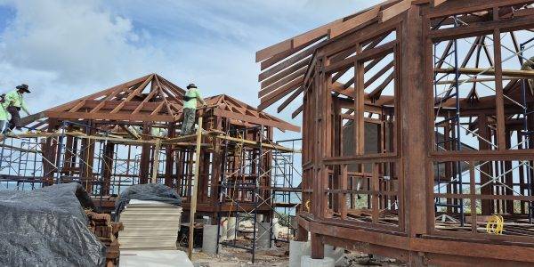 Timber structure in progress using sustainable Merbau wood, built on sandy shoreline