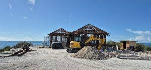 Early stage of villa construction with exposed Merbau beams, overlooking the ocean