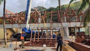 Touchwood team installing Merbau wood roofing in Seychelles luxury villa project